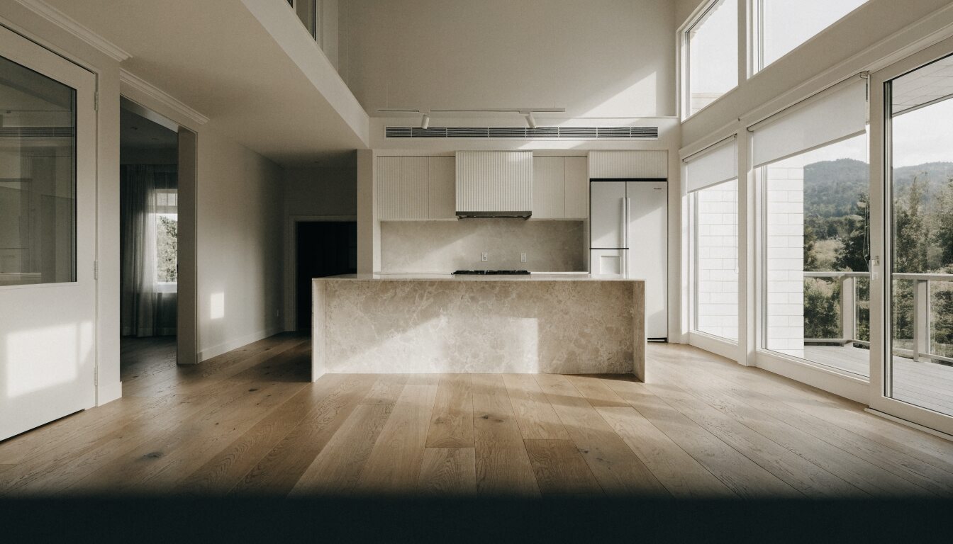 Beautifully renovated Vancouver home open-plan kitchen and living area, warm Pacific Northwest light through large windows