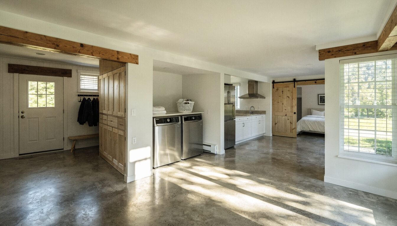 Legal basement suite in a Langley BC home: separate entry, open-plan kitchen and living, egress windows, and modern finishes.