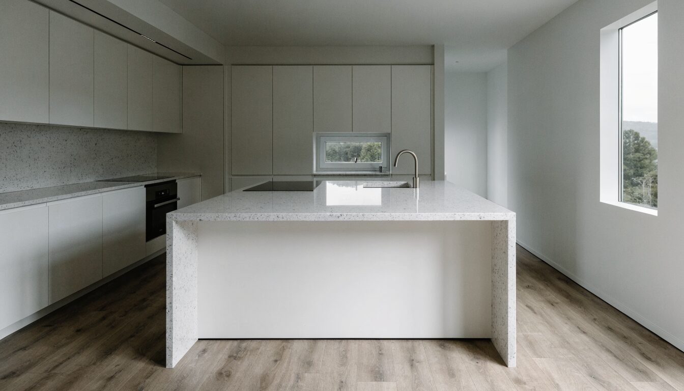 Renovated kitchen in a Richmond BC home: contemporary cabinetry, stone countertops, and stainless appliances.