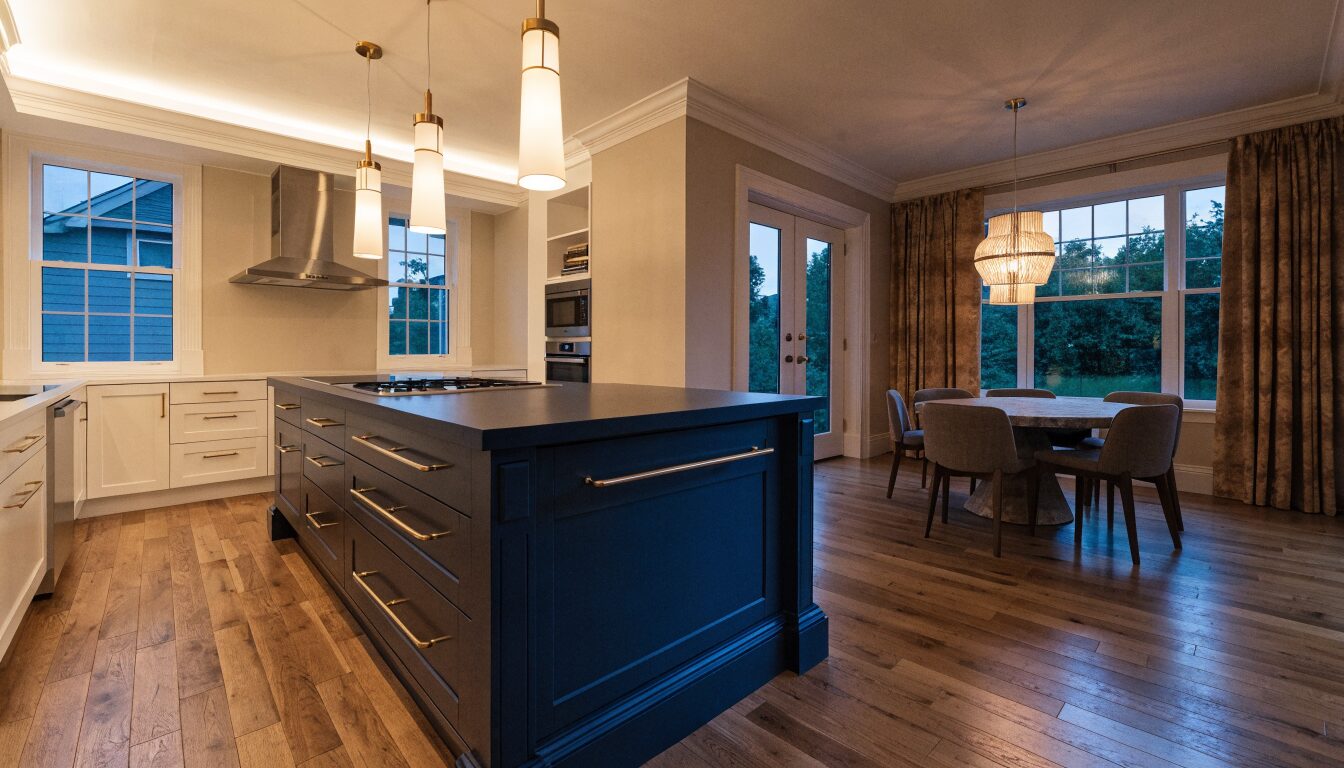Modern kitchen renovation in a Surrey home: white shaker cabinets, quartz island, and hardwood floors.
