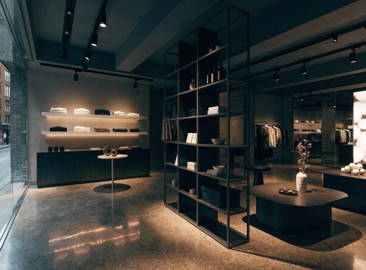 Completed high-end boutique retail interior in Vancouver with high-CRI track lighting over merchandise displays